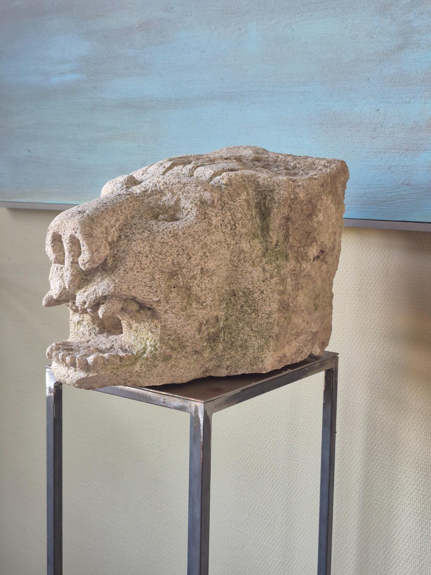 Antique stone gargoyle fragment