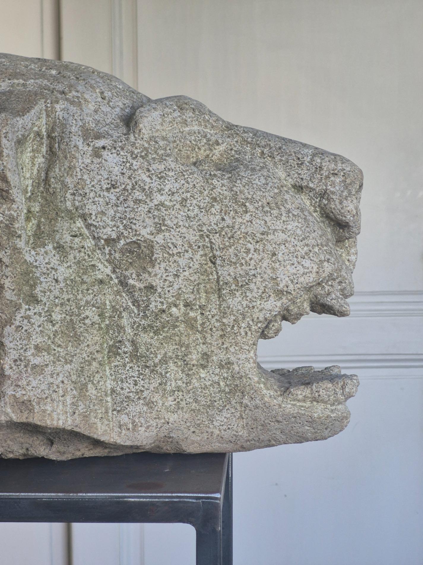 Antique stone gargoyle fragment
