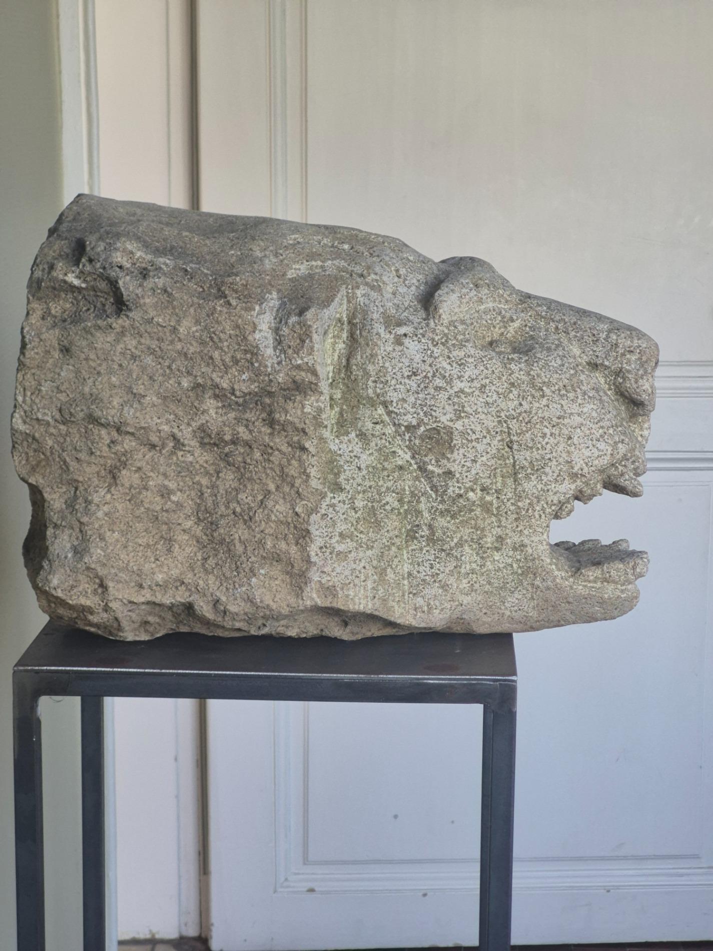 Antique stone gargoyle fragment
