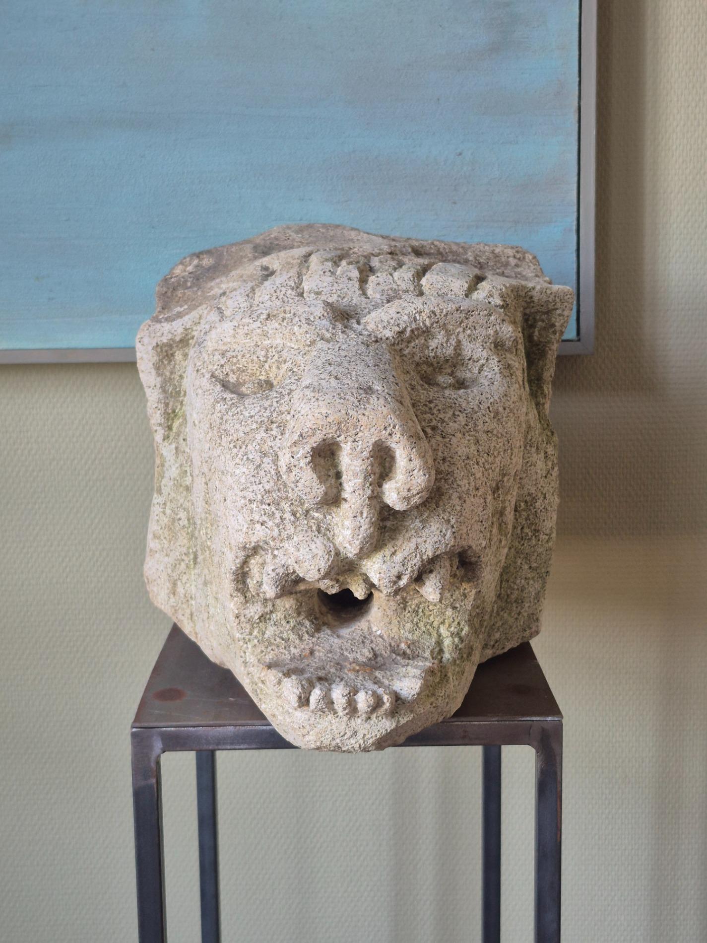 Antique stone gargoyle fragment