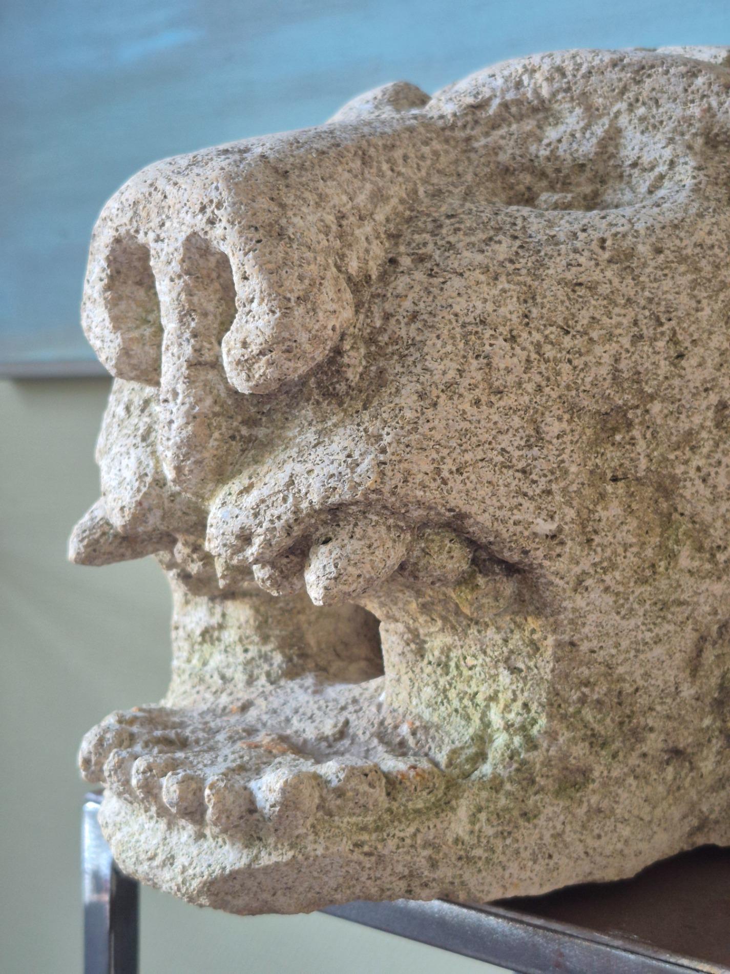Antique stone gargoyle fragment
